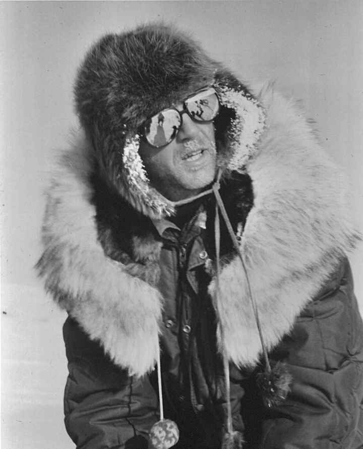 man-in-a-winter-suit-and-glasses-in-the-snow-antique-photo